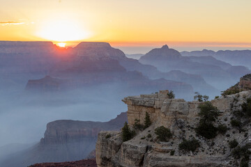 Fototapeta premium Smoke Filled Sunrise Landscape in Grand Canyon Naitonal Park Arizona