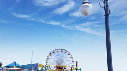 Santa Monica Ferris Wheel from a street lamp during the day
