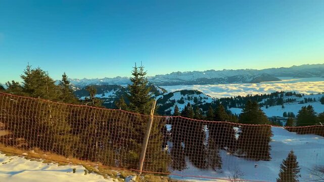 View from the window on the Rigi mountain railway. Switzerland. Magnificent mountain scenery at sunset.
