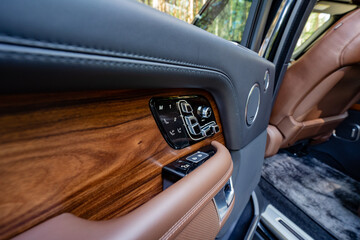 The cars luxurious interior features premium wood and highquality leather, radiating elegance and...