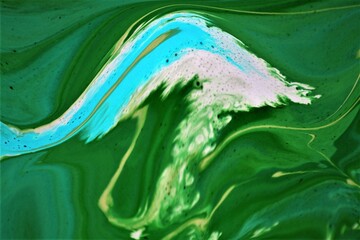 Abstract background of acrylic paint in green and white tones. Liquid marble pattern