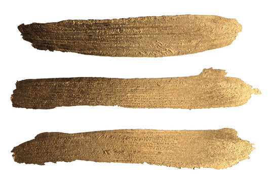 Torn, ripped gold, bronze foil smear brush stroke blot lines. Grunge texture stain isolated on white background.