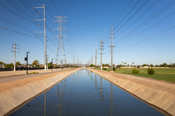 Canal with Pathways in Suburban Arizona, Midday Scene