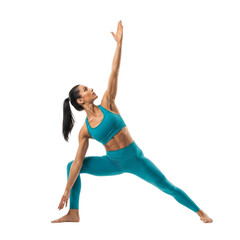 Fototapeta premium Woman practicing yoga pose in teal athletic wear for fitness and wellness on black background image stock photo on transparent background