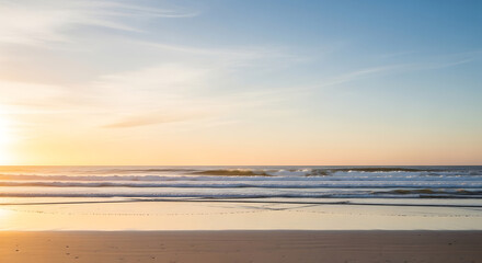 Vibrant Sunset Over Peaceful Ocean Waves and Reflective Sand