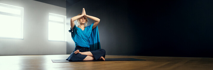 Woman Meditating in Yoga Pose Wide Banner with Copy Space