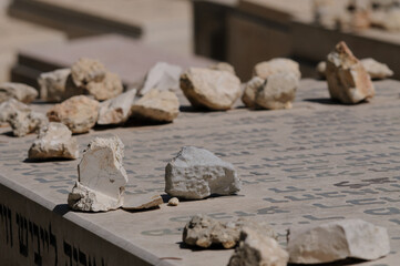 Jewish graves in Jerusalem. Mourners and visitors to a Jewish gravesite traditionally leave behind a small stone or pebble as a sign of their visit.