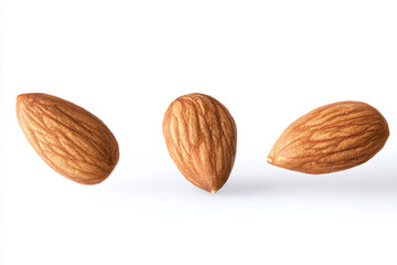 three almonds are shown on a white surface