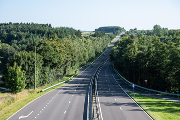 Steep National road N 89 through the woods in Vesqueville Saint Hubert, Belgium