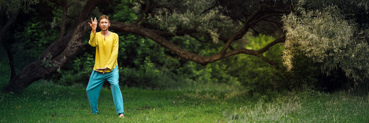 Man in Park Performing Gesture Wide Banner