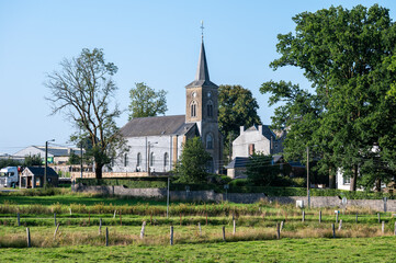 Rural landscape and green farmland in the village of Libramont, Province de Luxembourg, Belgium
