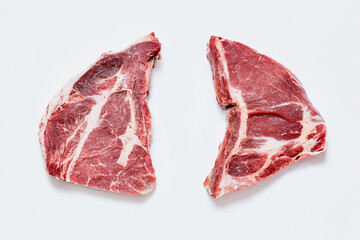 two pieces of meat are shown on a white surface