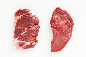 Obraz premium two pieces of meat are shown on a white surface