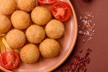 Cheese balls, croquettes or arancini with potatoes or rice. Cheese balls