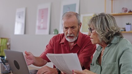 Senior couple arguing about bills in slow motion - Powered by Adobe