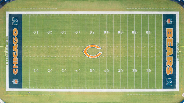 Chicago, IL, USA - August 18, 2025: An aerial view of Soldier Field, home to the Chicago Bears, football field centered with the logo in the center.