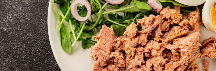 Tuna salad egg, arugula, vegetables tasty snack fresh delicious gourmet food background on the table rustic food top view copy space keto and paleo diet food pescetarian diet