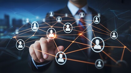 Businessman touching network of people icons in a connected system against a blurred city backdrop