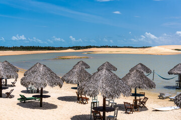 Straw huts on the banks of the Torta Lagoon, Tatajuba Beach at Jijoca de Jericoacoara, Ceara in...