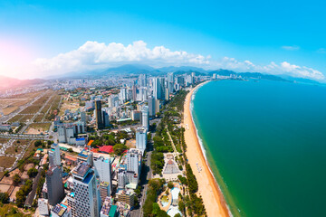 Central beach overlooking panoramic aerial view city shadow on the coast of Southeast Asia in...