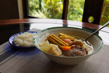 Olla de carne beef soup with vegetables, corn, potato, chayote, plantain, carrot, and beef. Typical dish of Costa Rica and Central America. Beef broth or meat soup accompanied with white rice.