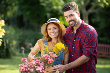 Man and woman enjoying gardening in springtime