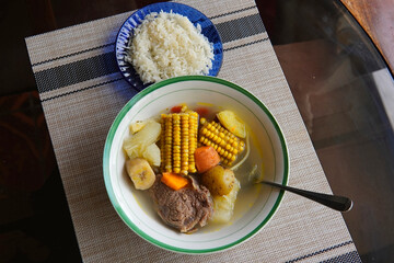 Olla de carne beef soup with vegetables, corn, potato, chayote, plantain, carrot, and beef. Typical dish of Costa Rica and Central America. Beef broth or meat soup accompanied with white rice.