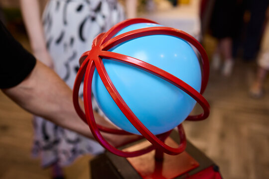 A colorful Balloon Hat adds fun and creativity to a lively community event celebration