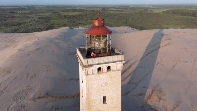 Aerial view of the giant sand dunes with the famous lighthouse on the top of a hill. Rubjerg Knude Lighthouse, , North SeaRubjerg , Sunset at the lighthouse Rubjerg Knude Fyr near Lokken in Denmark. 