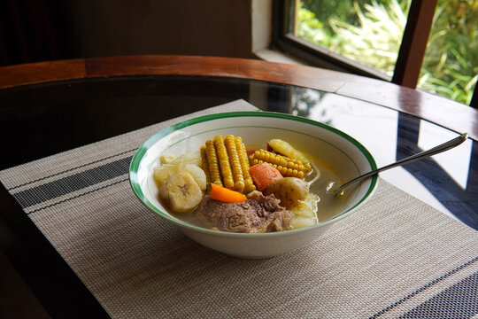 Typical Costa Rican soup called olla de carne with corn, potato, chayote, green plantain, carrot, typical Mexican and Central American food, broth called caldo de res or meat soup