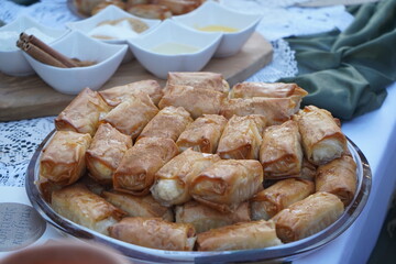Close up of traditional Cretan sweet mpoureki (μπουρέκι) with myzithra cheese, arranged on...