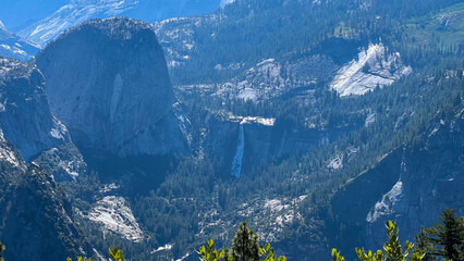 mountain landscape with waterfa, view of Yosemite Valley including Half Dome from Glacier Point, in Yosemite National Park in the western Sierra Nevada Mountains of Central California , USA. July 2025