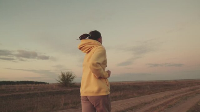 girl runs to fitness workout on road, cardio load on healthy body, morning jogging, follow beauty of figure, be slender woman, sports preparation for treathlon competition, happy man outdoors nature.