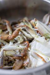 raw cooked crab on a white plate