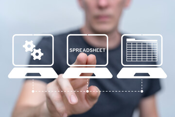 Business person using virtual touch screen presses text: SPREADSHEET. Spreadsheet Document...