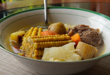 Close-up of a typical Costa Rican soup called Olla de Carne, a typical Costa Rican dish with white...