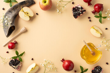Rosh Hashanah arrangement featuring a shofar, honey dish, apples, pomegranates, and decorative...
