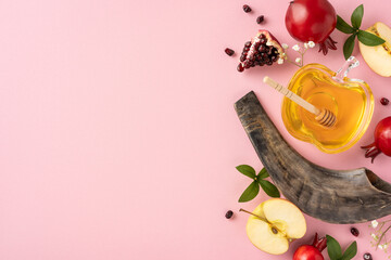 Rosh Hashanah themed setup featuring honey, apples, pomegranates, and shofar on a pastel background to represent the Jewish New Year celebration and its traditional symbols of sweetness and renewal