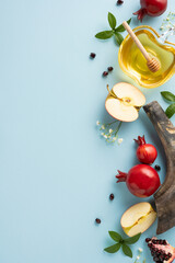 Apples, honey, pomegranates, and festive accents symbolize the Jewish New Year vertical celebration of Rosh Hashanah