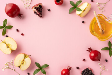 Celebration of Rosh Hashanah with symbolic fruits including apples and pomegranates arranged on a soft background. The honey represents sweetness for the upcoming year