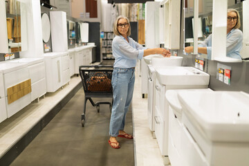 Shopping for bathroom fixtures in a home improvement store during daytime