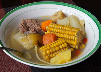 Close-up of a typical Costa Rican soup called Olla de Carne, a typical Costa Rican dish with white rice, chayote potatoes, carrots, and green plantains. Beef soup with vegetables,mexican soup