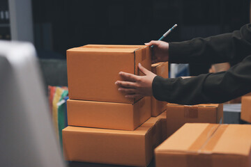 Portrait of Starting small businesses SME owners, two Asian woman check online orders Selling...