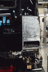 A broken car with a violation of geometry is on the frame for straightening. Restoration of cars...