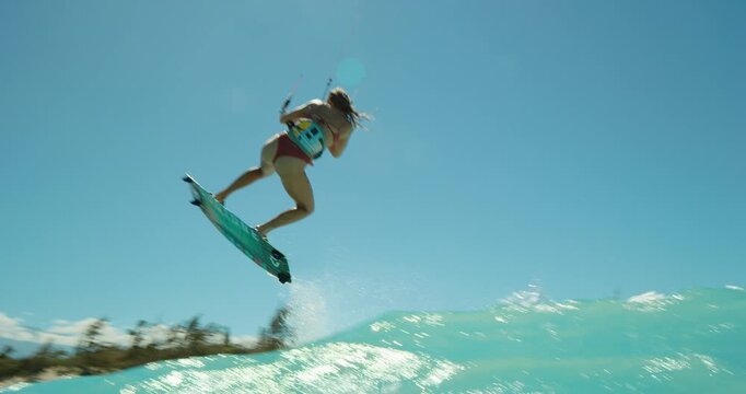 Woman kite surfing in Ocean