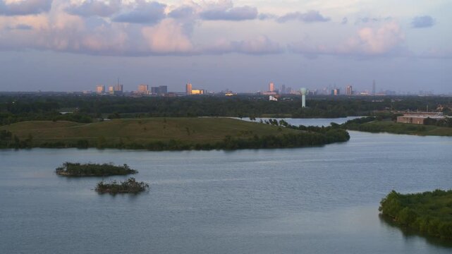 &ldquo;Drone view of bayou reservoir in Southwest Houston with cityscape background