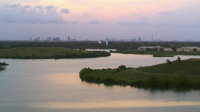 &ldquo;Drone view of bayou reservoir in Southwest Houston with cityscape background