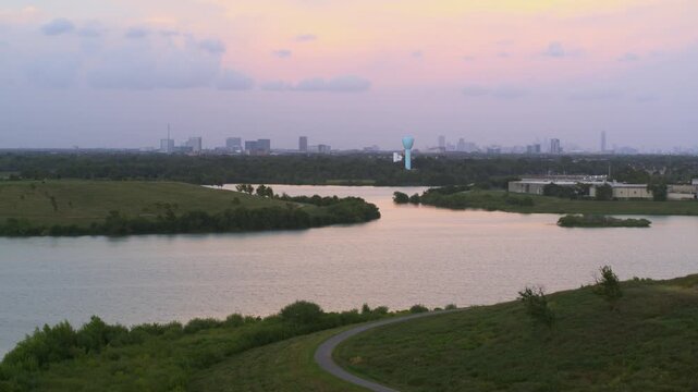 &ldquo;Drone view of bayou reservoir in Southwest Houston with cityscape background