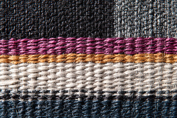 Artisan handwoven textile detail with intricate textures and threads artisan