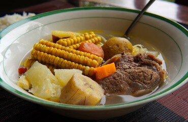 Close-up of a typical Costa Rican soup called Olla de Carne, a typical Costa Rican dish with white...